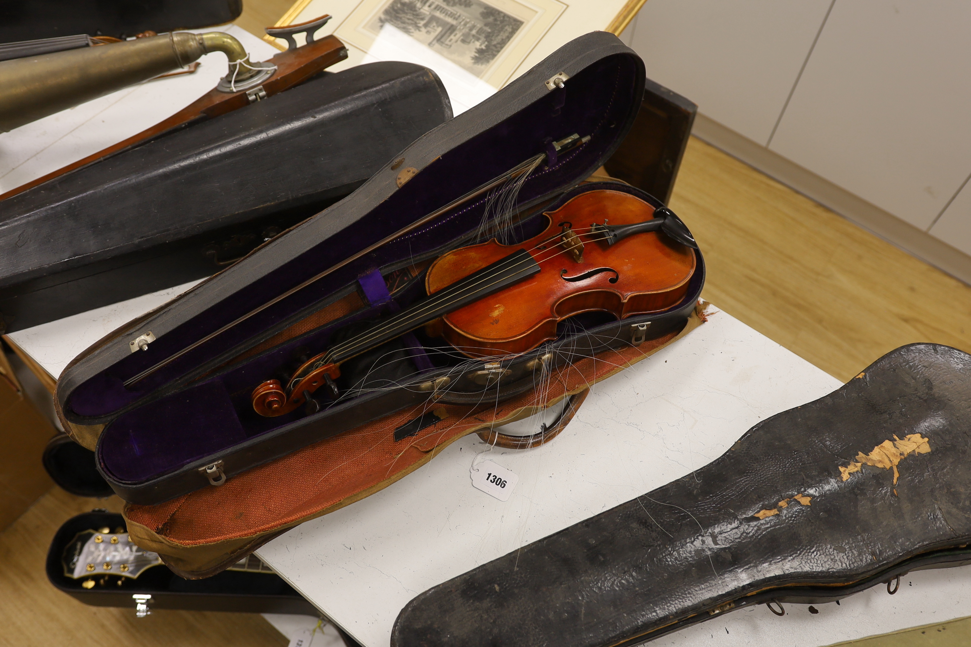 A French violin, c. 1900, with a retailer’s label inside the body for Thomas Smith, 183 Sherlock St. Birmingham, cased with a bow, body 35.5cm